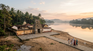 Mantralayam travel guide: South Indian mutt complex on the Tungabhadra riverbank at dawn with distant pilgrims