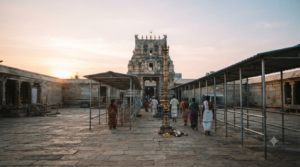 Narayanavanam temple timings with pilgrims approaching a South Indian temple entrance in morning light