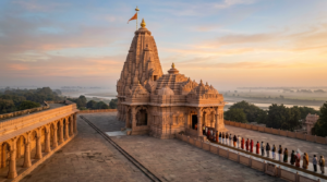 Rama temples in North India - sandstone Nagara-style temple spire at sunrise with pilgrims queueing in the courtyard