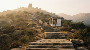 Sholingur Anjaneyar temple timings guide: pilgrims climbing the steep Chinna Malai steps at sunrise