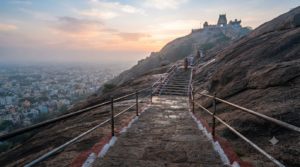 Uchi Pillayar Temple timings guide with Rockfort steps in early morning light