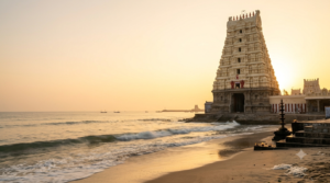 Tiruchendur daily pooja timings — Murugan temple gopuram by the sea at dawn
