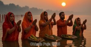 Devotees standing waist-deep in water offering prayers and arghya to the rising sun during Chhath Puja 2025