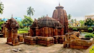 Mukteswara Swamy Temple Mokshagundam entrance with devotees and village backdrop.